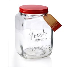 a glass jar with a red lid is shown