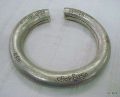 "VINTAGE ANTIQUE TRIBAL OLD SILVER BRACELET BANGLE SET 2pc FROM RAJASTHAN INDIA, NICE DESIGN EASY TO WEAR BY LITTLE TWIEST, GOOD FOR JEWELRY COLLECTION. Note - set is much worn & dent check pictures carefully for more detail. weight for set - 144 grams Inner diameter side to side - 6.5 cm(2.55\") Ineer circumference without open part - 17.8 cm(7\") width - 1.2 cm material - Silver and original old worn set." Silver Antique Finish Bangle As Gift, Vintage Oxidized Bangle For Weddings, Silver Bangle With Antique Finish As Gift, Vintage Oxidized Round Bangle, Silver Vintage Bracelet For Festivals, Unique Silver Bangle For Rituals, Vintage Bangle For Rituals And Festivals, Vintage Silver Bracelet For Festivals, Vintage Silver Bracelet For Festival Style