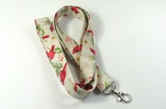 This cute lanyard has beautiful red birds. This lanyard is very beautiful in person. You can have a wardrobe of lanyard to match your outfit. This lanyard is made of soft 100% cotton fabric to give a comfortable feel around your neck. This lanyard is easy to take care. You can spot clean and throw in a washer and hang dry. If you want you can iron and it is ready to use. These lanyards are perfect if you have metal allergy. Each of these lanyards will have a slight different pattern depending on Cute Lanyard, Cute Lanyards, Patriotic Fabric, Fabric Lanyard, Red Bird, Have Metal, Red Birds, Badge Holder, Badge Holders Lanyard