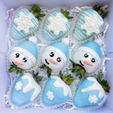 a box filled with blue and white frosted treats