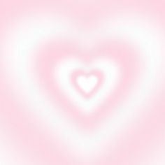 a blurry pink background with a heart shape