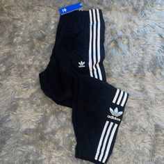 New Pockets Fitted Black Joggers For Spring, Adidas White Streetwear Pants, Adidas Fitted Sweatpants For Spring, Adidas Three Stripes Spring Pants, Fitted Adidas Pants With Three Stripes Branding, Adidas Fitted Cotton Bottoms, Adidas White Lounge Pants, Fitted Adidas Cotton Bottoms, White Lounge Pants With Three Stripes