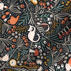 a black background with orange, white and blue cats in the forest on it's sides