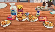 some food is sitting on plates on a wooden table in the middle of a kitchen