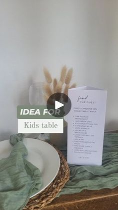 the table is set up with a menu and place card for children's table