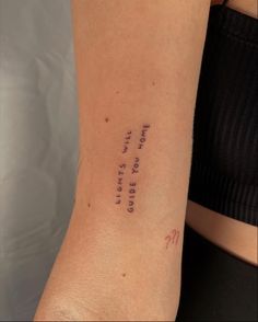 a woman's arm with writing on it