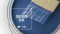 a paint can with a brush in it and the words southern blue painted on it