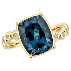 Introducing a new ring style that represents luxury, fashion, and personal flair. The collection includes antique rings adorned with beautiful gemstone London blue topaz. One standout piece is a London blue topaz ring surrounded by dazzling diamonds. This ring, crafted in 18karat yellow gold, showcases an elegant and timeless design. London Blue Topaz Fancy Ring in 18Karat Yellow Gold with White Diamond. London Blue Topaz: 5.18 carat, 11X9mm size, cushion shape. White Diamond: 0.11 carat, 1.50mm Hand Rings, Fancy Rings, London Blue Topaz Ring, Right Hand Rings, Naha, Brown Diamond, Ring Style, London Blue Topaz, Blue Topaz Ring