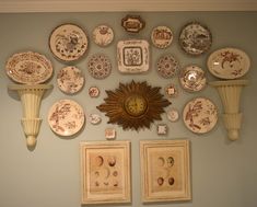 there are many plates on the wall