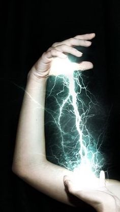 a woman's arm with lightning in the background