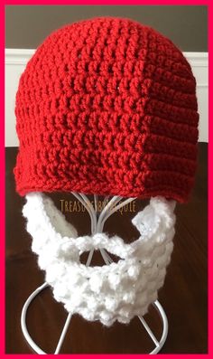 a red crocheted hat on top of a white headband