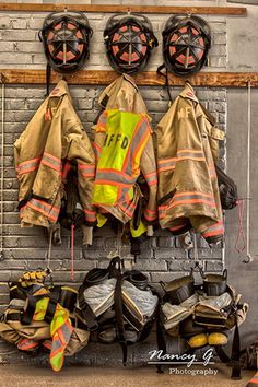 fire fighters gear hanging up on the wall