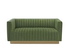 a green velvet couch with gold legs and arms on an isolated white background, the back is