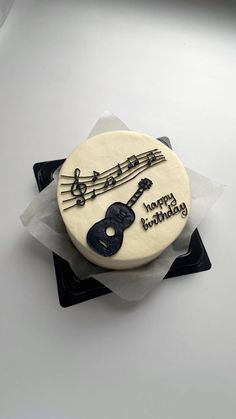 a birthday cake decorated with musical instruments