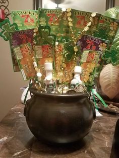 a pot filled with lots of lucky charms on top of a table next to other items