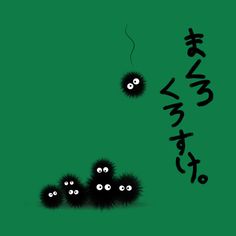 two black balls with eyes are in front of a green background that says happy new year