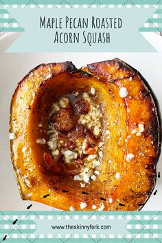 an acorn squash is topped with walnuts and crumbled nuts in the center