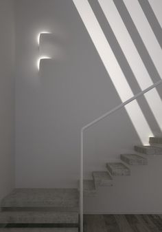 the light is shining on some stairs