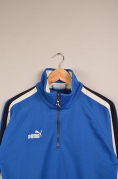 "vintage puma blue track jacket in good vintage condition without stains or holes. Size: Not available ( see the measurements ) Measurement: - Chest(armpit to armpit: 50cm(19.6\") - Length from the backside(Center bottom of the collar to center bottom of the garment): 66m(25.9\") - Sleeve(COLLAR seam to end of arm cuff): 73cm(28.7\") NOTE: Because of the age, clothing can shrink or the sizing from that time wasn't the same as the size from modern clothing. Make sure you have checked our measurem Blue Tracksuit For Winter Streetwear, Blue Winter Tracksuit For Streetwear, Blue Tracksuit For Fall Streetwear, Blue Cotton Track Jacket For Sports, Retro Blue Sweatshirt For Sports, Blue Crew Neck Track Jacket For Streetwear, Blue Sporty Crew Neck Track Jacket, Blue Crew Neck Track Jacket, Long Suede Coat