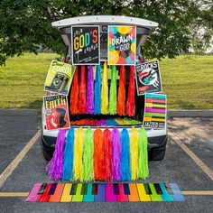 a car that is parked in a parking lot with some decorations on the side of it