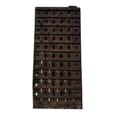 a large wooden rack with many holes in the middle and one hole at the top