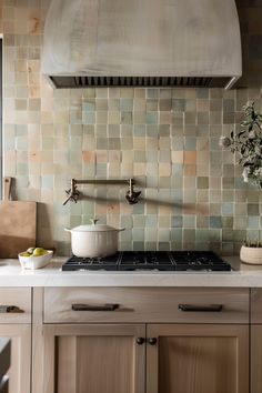 a stove top oven sitting inside of a kitchen next to wooden cabinets and counter tops