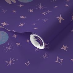 a purple wallpaper with stars and circles on it