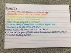 a piece of paper with writing on it that says duality and multicolored lines