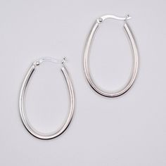 Free shipping over $100, free returns within 30 days. Thai handcrafted sterling silver oval hoop earrings. ﻿We donate at least five percent of every sale to causes that support our mission. Click here for more information. Oval Hoop Earrings, Silver Hoops, Silver Hoop Earrings, Hoop Earrings, Charms, Gemstones, Sterling Silver, Free Shipping, Silver