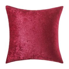 a red velvet pillow on a white background