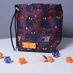 the dice bag is filled with orange and blue dices