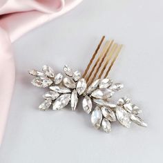 The bridal hair comb is made with rhinestones, clear crystals, opal crystals, and silver-plated wire. Beautifully suited with a range of wedding hairstyles. It's the perfect rhinestone hair pin for the bride with exquisite taste. - LENGTH of the wedding hair piece is approx. 3,6 inch (9,2 cm)  - WIDTH of crystal decoration approx. 1,4 inch (3,5 cm).  - Total WIDTH including hair comb approx. 2,6 inch ( 6,5 cm)  You can choose the primary color of wire and comb SILVER or GOLD. Also, you can choose the secondary color of CRYSTALS :  -only clear crystal ( pictured). -white opal, -milky pink opal, -milky blue opal -only opal crystals, -YOUR variation (custom order). I'm in love with OPAL. See other opal hairpieces https://etsy.me/2Mxdcxu PACKAGING All my bridal hair pins come in a gift box wit Wedding Clip-on Crystal Earrings With Sparkling Stones, Diamond Hair Comb, Turquoise Hair Comb, Crystal Comb, Rhinestone Hair Pin, Wedding Hair Piece, Rhinestone Hair Comb, Crystal Hair Pins, Crystal Hair Comb