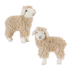 two stuffed sheep standing next to each other