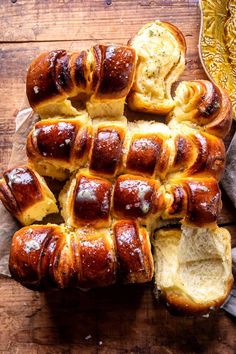 hot dogs wrapped in bread on a wooden table