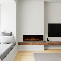 a living room with white walls and a fireplace