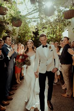 a newly married couple walking down the aisle