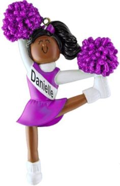 a girl cheerleader ornament with purple pom poms