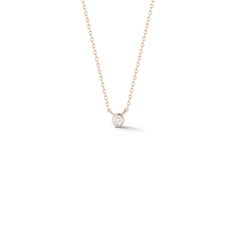 Sometimes, simple is best. There is nothing as classic and chic as a diamond layering necklace. A single round brilliant diamond wrapped in a 14 karat gold bezel hangs on an adjustable 14k gold cable chain for a look you'll never tire of. This understated minimal beauty will look gorgeous on its own and shine among your other layering necklaces when you want to curate your custom stack. 14 Karat Gold 0.03 Diamond Carat Weight Pendant is 2.7mm in Diameter Diamonds are G/H Color and SI Clarity Adj Everyday Solitaire Necklace With Round Diamond Pendant, Everyday Diamond Solitaire Necklace With Adjustable Chain, Minimalist Diamond Solitaire Necklace With Smooth Bezel, Everyday Fine Jewelry Solitaire Necklace With Adjustable Chain, Everyday Solitaire Necklace With Adjustable Chain, Minimalist Yellow Gold Necklace With Smooth Bezel, Minimalist Yellow Gold Bezel Necklace, Minimalist 14k Gold Diamond Necklace With Bezel Setting, Minimalist Yellow Gold Solitaire Necklace With Smooth Bezel