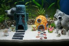 an aquarium filled with lots of different types of plants and animals on top of it