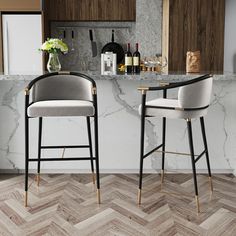 two bar stools sitting next to each other in front of a marble counter top