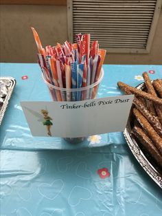 there are many different types of toothbrushes in the cup and on the table