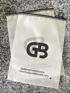 two white bags with black logos on them