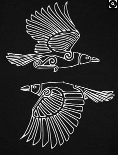 two black and white drawings of birds on a black shirt, one flying in the air