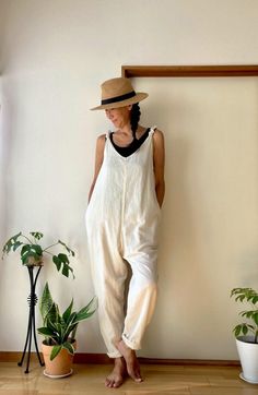 Back in stock!  This is a very comfortable 100% cotton summer jumpsuit. Using exactly the same cotton for lining. ( Double cotton ) The fabric is very soft and gentle touch to your skin. There are side pockets.  - Material: 100% cotton  ( Double  layered ) - 3colors :  Cream   Olive   Black - Hem: Cut-Off - Side Pockets - Size : One size - Bust : Approx 104cm/ 40" - Hip : Approx. 112cm/45" - Length : Approx. 140 cm/55"   ** Model height : 167 cm /  5.4 ft ** - Care for Cream, Olive and Black colors : Hand wash in cold water is recommended. If you use a washing machine please use a laundry net. Hang to dry in the shade. - About Natural Indigo dye Natural Dyed Indigo has a certain depth of color and reflects light in a way that is very different from chemical dyes. It may have uneven fabric Summer Jumpers, Black Jumpsuits, Beach Jumper, Slim Jumpsuit, Natural Indigo Dye, Summer Jumpsuit, Womens Jumpsuits, White Jumper, Cotton Labels