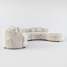 a curved sectional sofa with pillows on the top and bottom, sitting in front of a white background