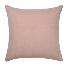 a light pink pillow on a white background