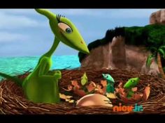 an animated image of a green dinosaur in a nest