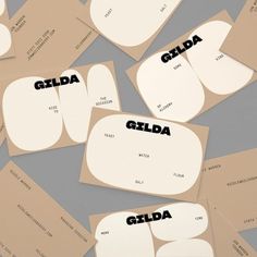 several pieces of paper with the words gildda on them, all in different shapes and sizes