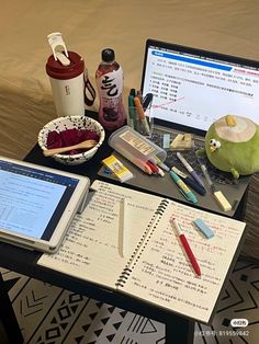 an open laptop computer sitting on top of a table