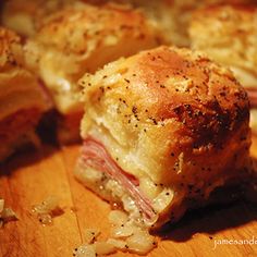 ham and cheese sliders cut in half on a cutting board